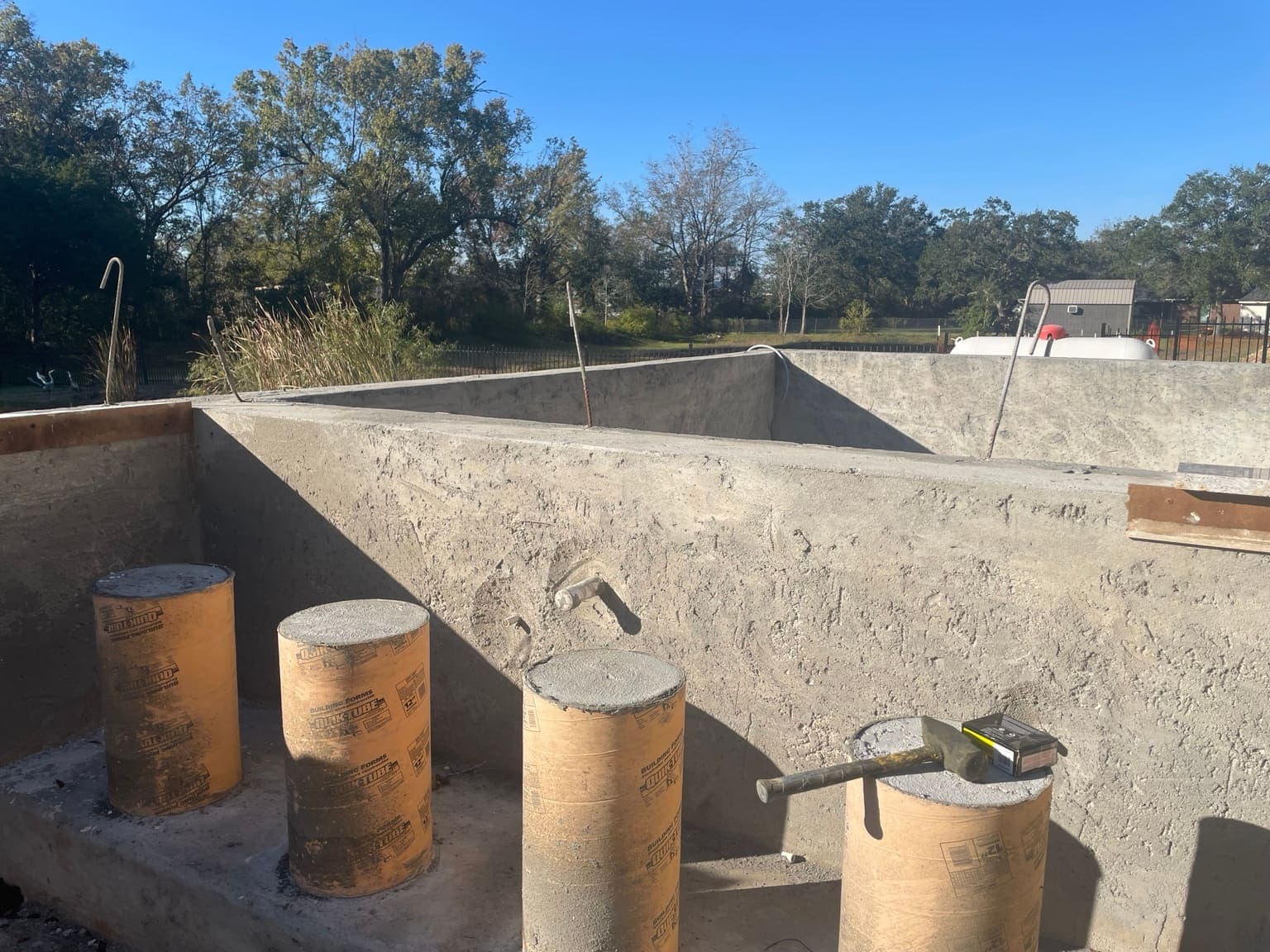 Pool renovation in progress showing fresh gunite repair